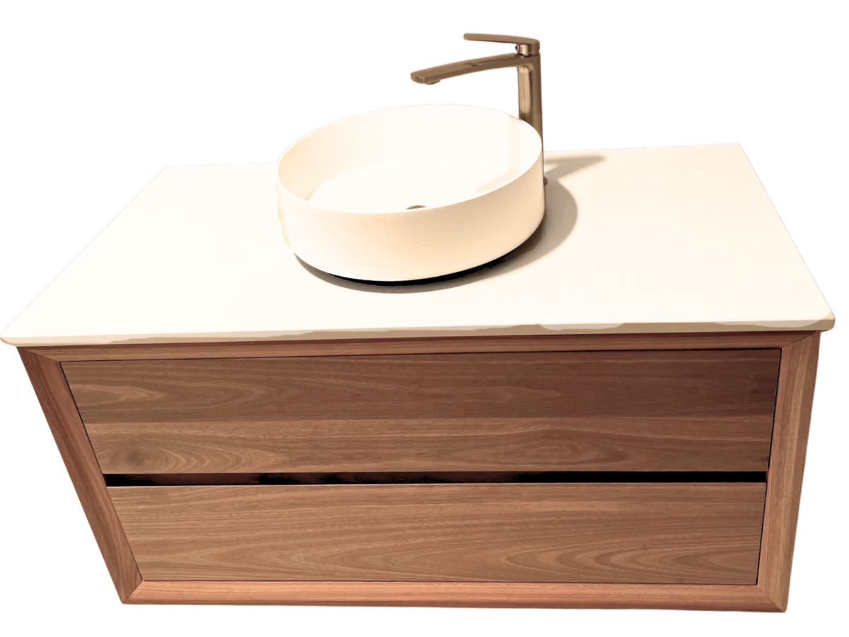 Custom timber vanity unit with white countertop and round basin, showcasing handcrafted quality and design flexibility.
