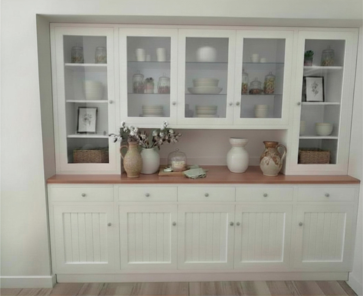 White coastal buffet and hutch with louvered doors and wooden top in a bright modern interior