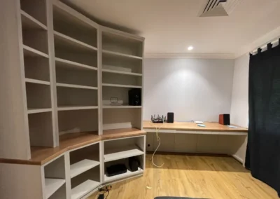 After. Custom shelving, increased desk space.